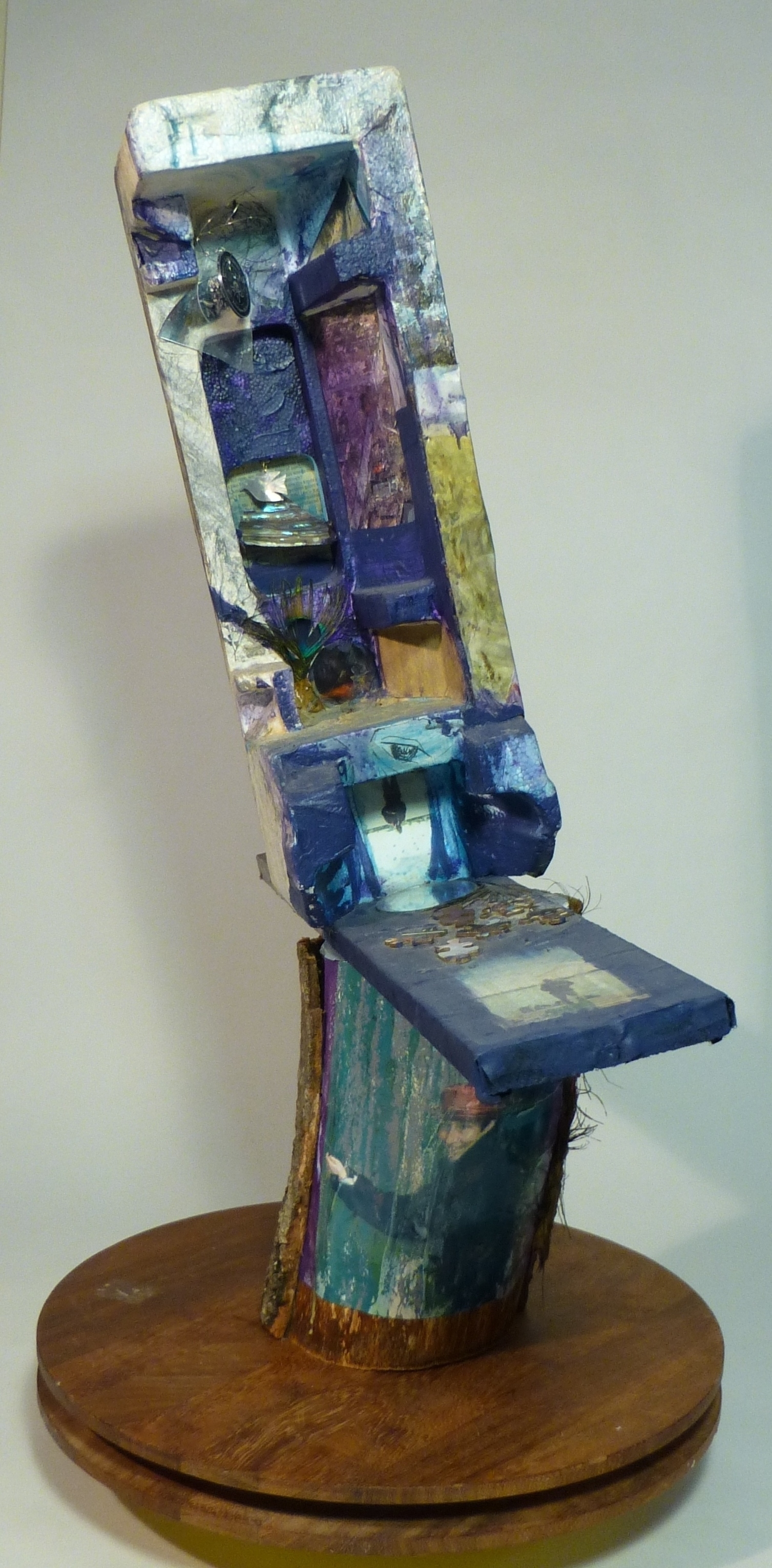 Mixed media polystrene sculpture on log and wooden base